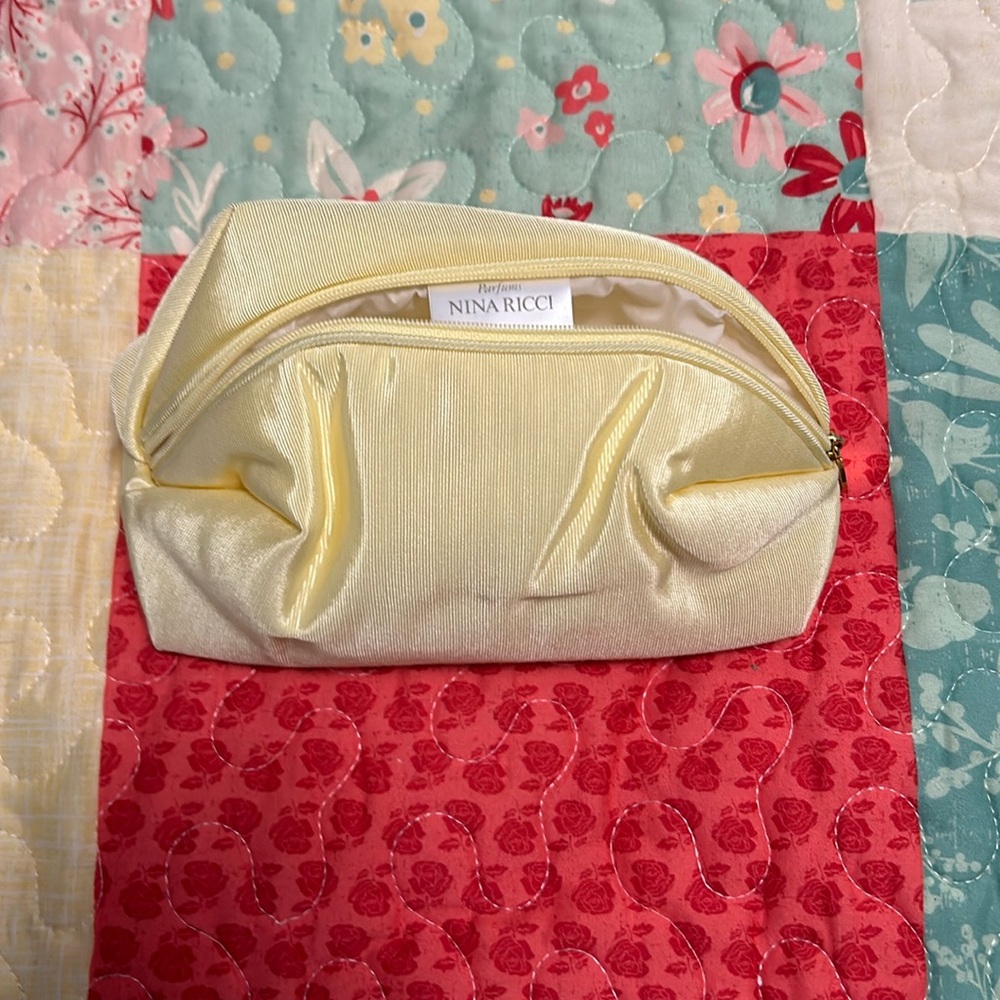 NINA RICCI Yellow cosmetic bag new